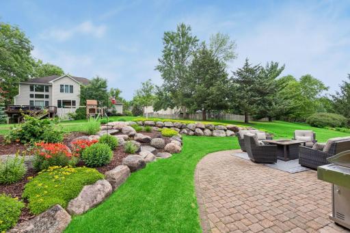 Step outside to enjoy your own backyard retreat, complete with spacious paver patio, beautiful perennial gardens, and plenty of room to relax or entertain.