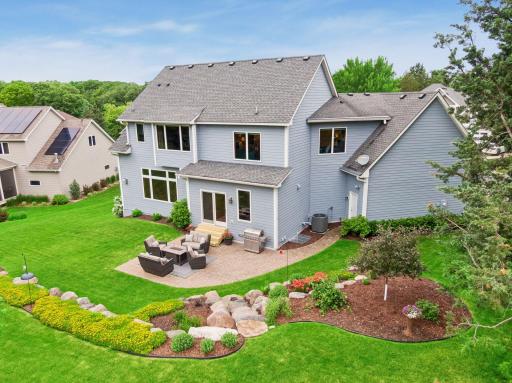The backyard offers a park like feel with its mature landscaping, colorful perennial gardens, and a paver patio thatâs ideal for gathering with family and friends.