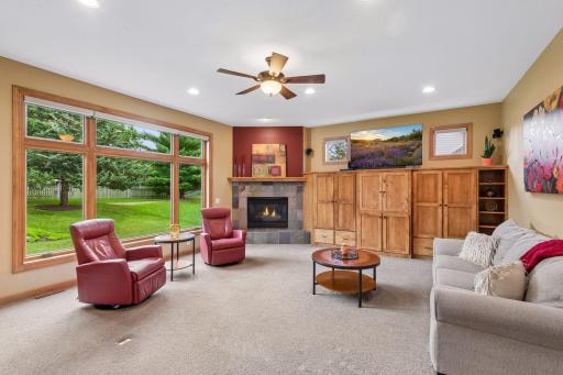 A beautiful fireplace and custom built-ins create a cozy and warm focal point, making this a room youâll love spending time in.