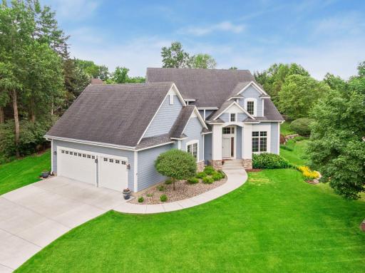 Beautifully positioned on a meticulously maintained lot, this custom-built home showcases exceptional curb appeal, mature landscaping, and a grand front entry.