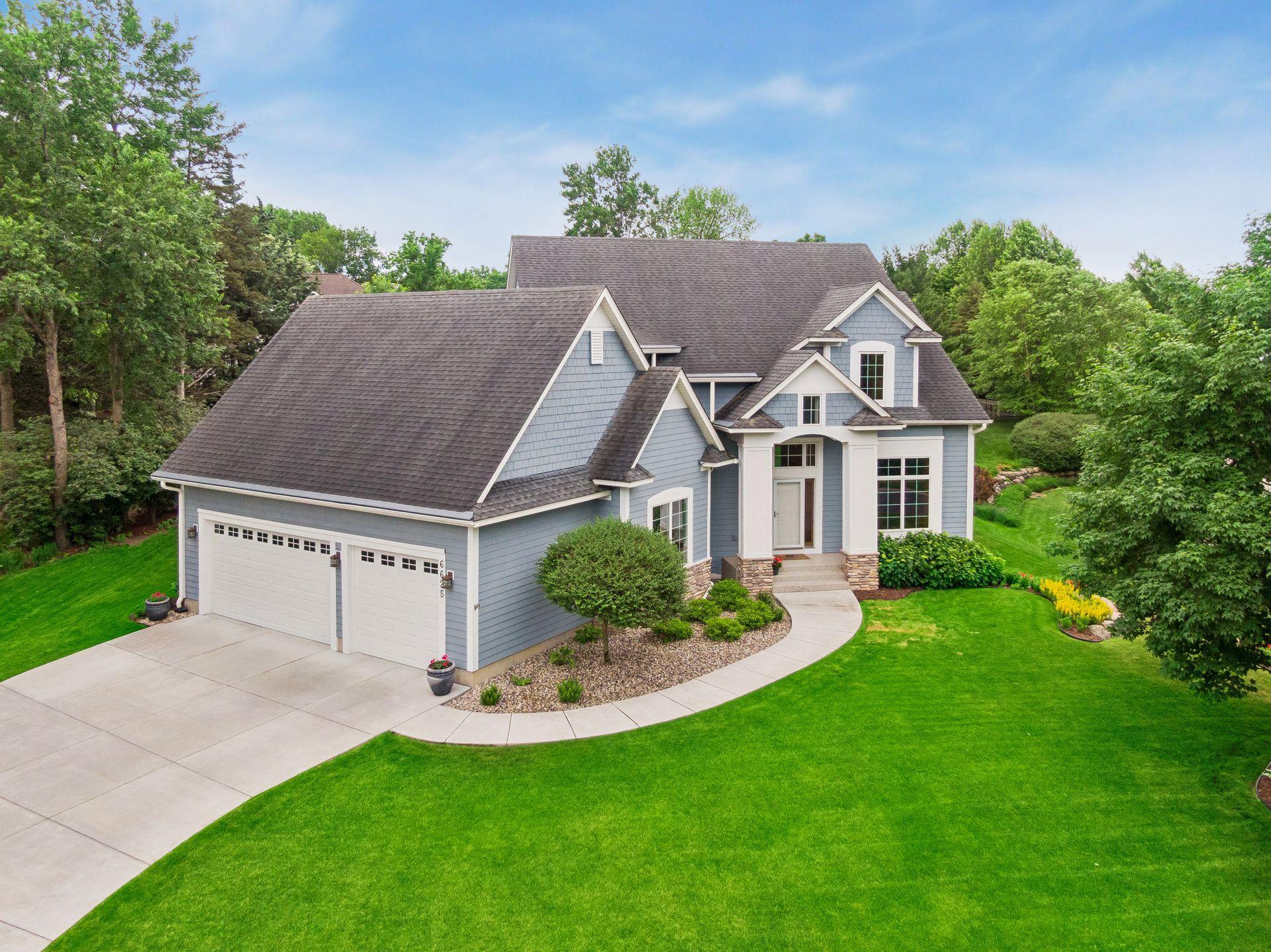 Beautifully positioned on a meticulously maintained lot, this custom-built home showcases exceptional curb appeal, mature landscaping, and a grand front entry.