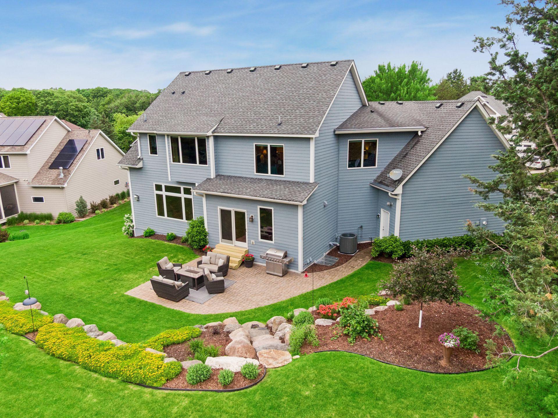 The backyard offers a park like feel with its mature landscaping, colorful perennial gardens, and a paver patio that’s ideal for gathering with family and friends.