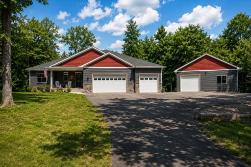 Nestled among mature trees on 1.57 acres in the Lakes of Fairhaven community, this walkout rambler offers the perfect blend of modern comfort, quality finishes, and peaceful acreage living.
