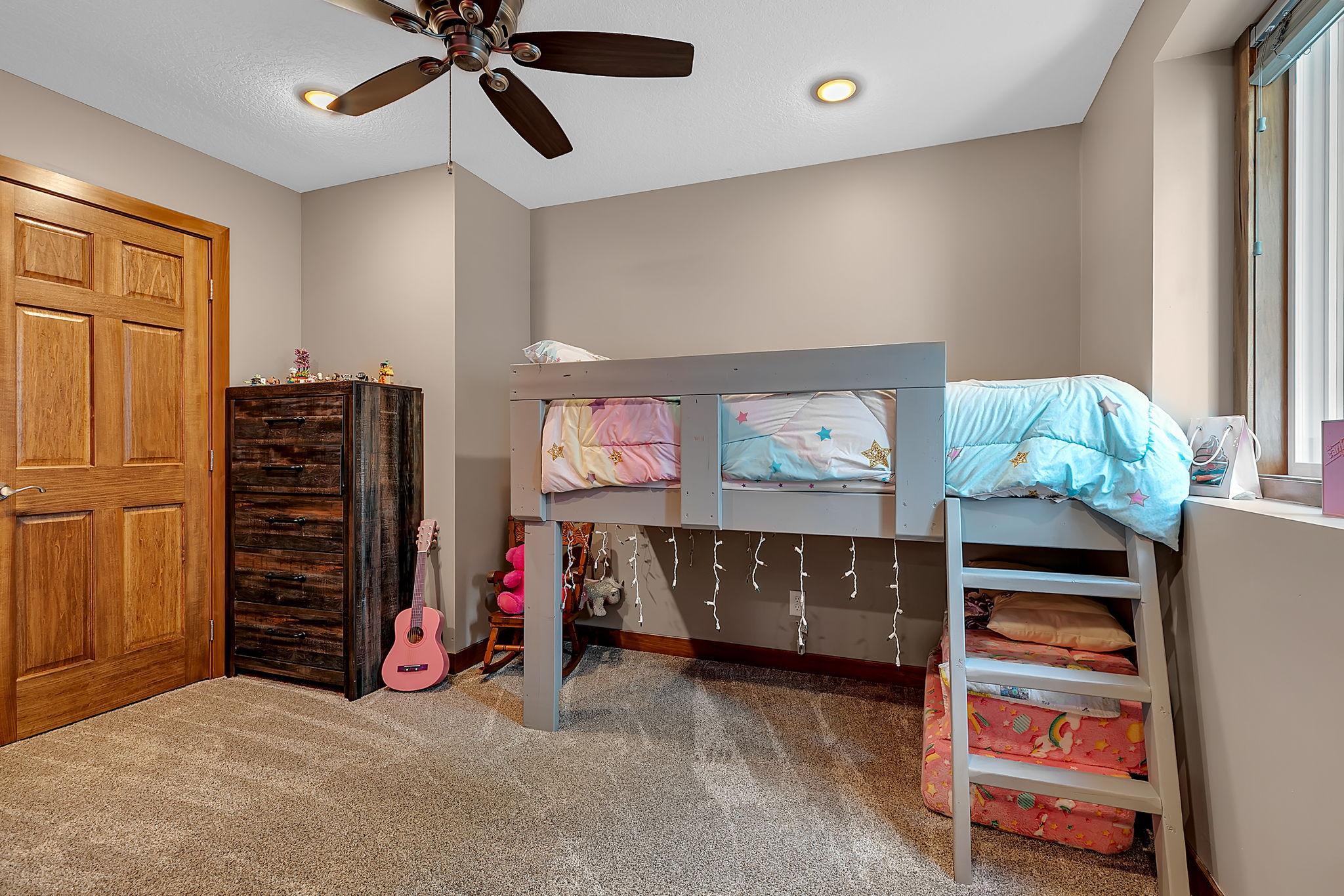 The second lower-level bedroom offers a large closet and a flexible layout that can easily adapt as your needs evolve.