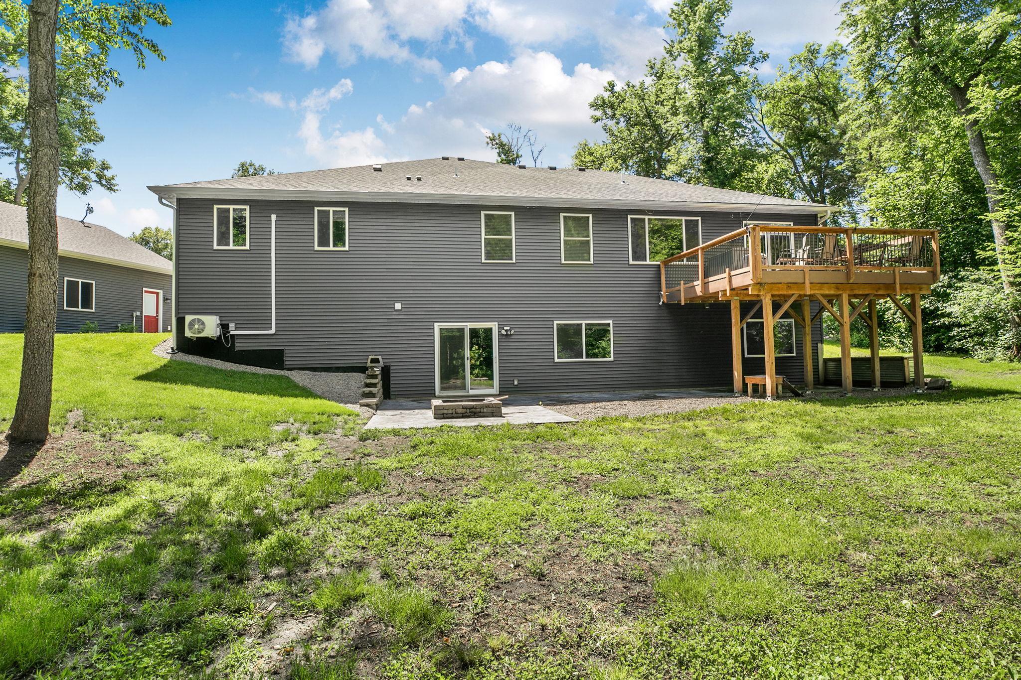 Whether gathering on the deck, enjoying evenings around the fire pit, or spending time in the expansive backyard, this property was designed for making memories with family and friends.