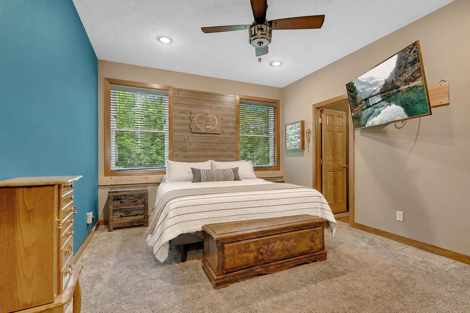 The private primary suite offers a generous layout, a large walk-in closet, and an adjoining ensuite bath, creating a comfortable and functional owner's retreat.