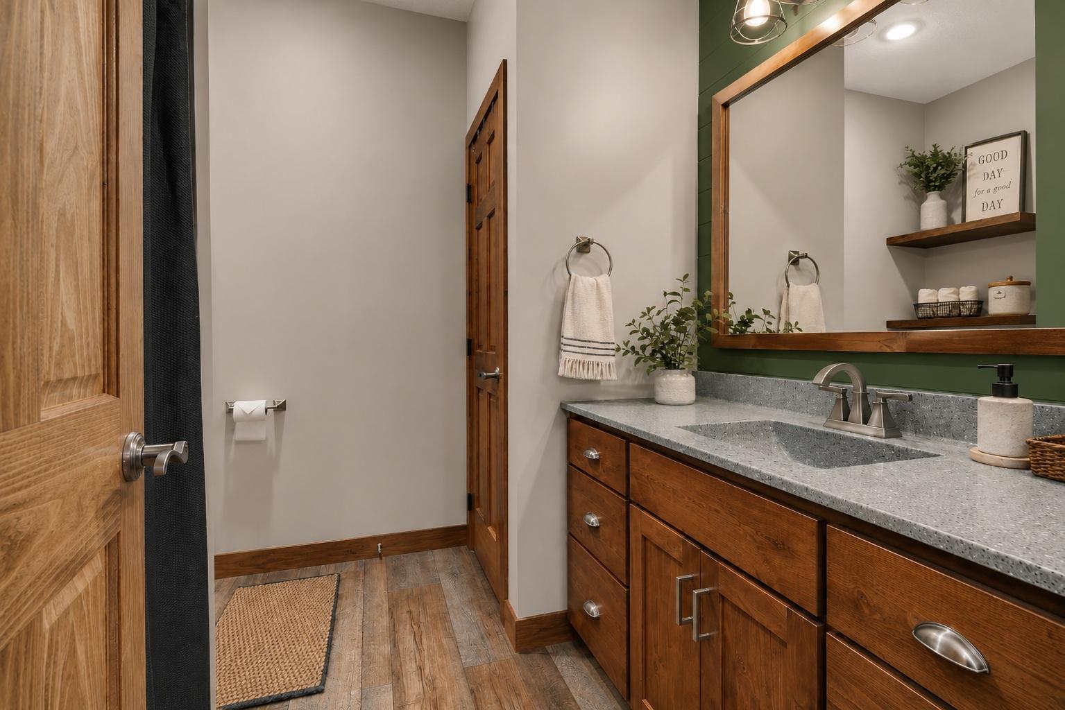 Enjoy the convenience of a private 3/4 bath, oversized vanity, and abundant cabinet space to keep everyday essentials within easy reach.