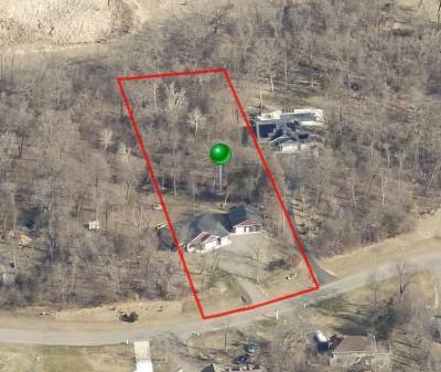 Surrounded by mature trees and conveniently located near area lakes, parks, and local amenities, this property offers a rare combination of newer construction, versatile living spaces, exceptional garage capacity, and the privacy of acreage living.