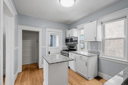 large pantry at back of kitchen along with entry to back porch.