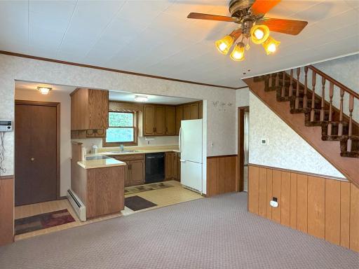 This open kitchen and dining area offers a comfortable layout that keeps family and guests connected.