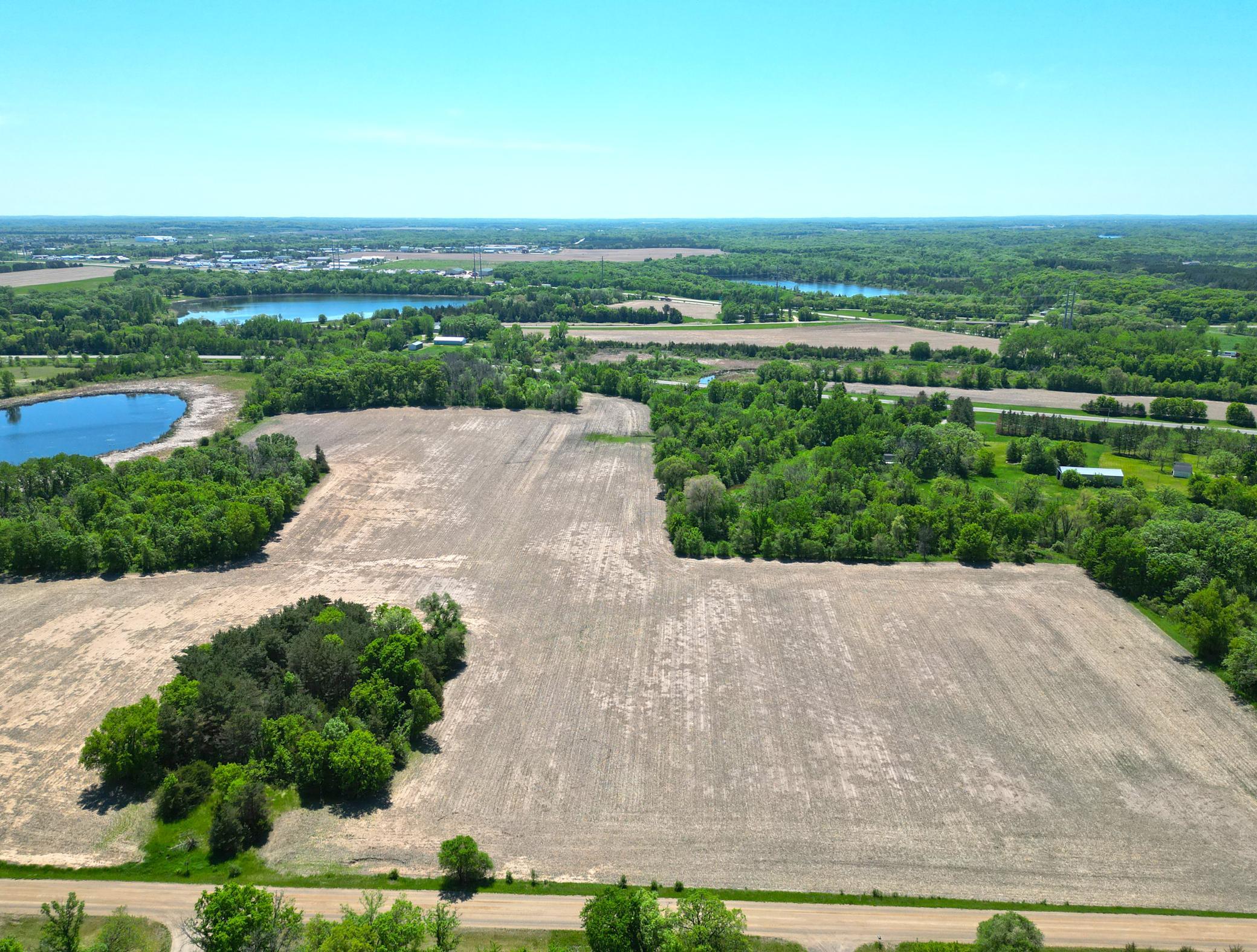 Beautiful 11.23-acre setting on Plum Creek featuring a blend of lightly wooded landscape and open farmland.