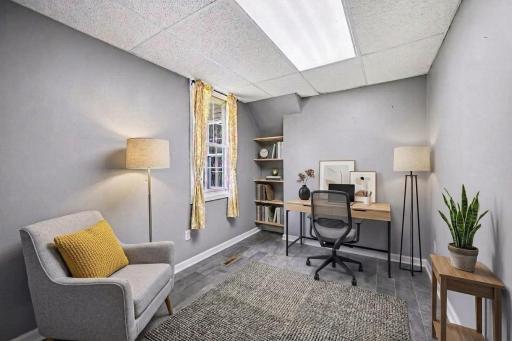 A real home office on the main level, virtually staged and ready for remote work
