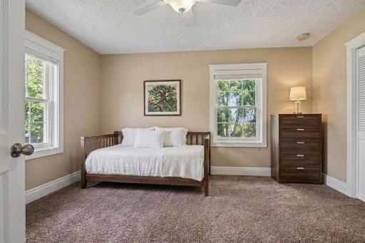 One of two main level bedrooms, virtually staged to show what's possible