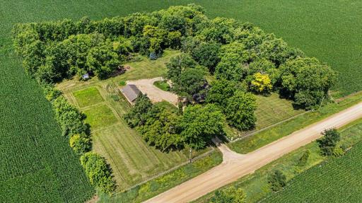 Aerial view showing the farmhouse, detached garage, and pasture layout on Aberdeen Avenue