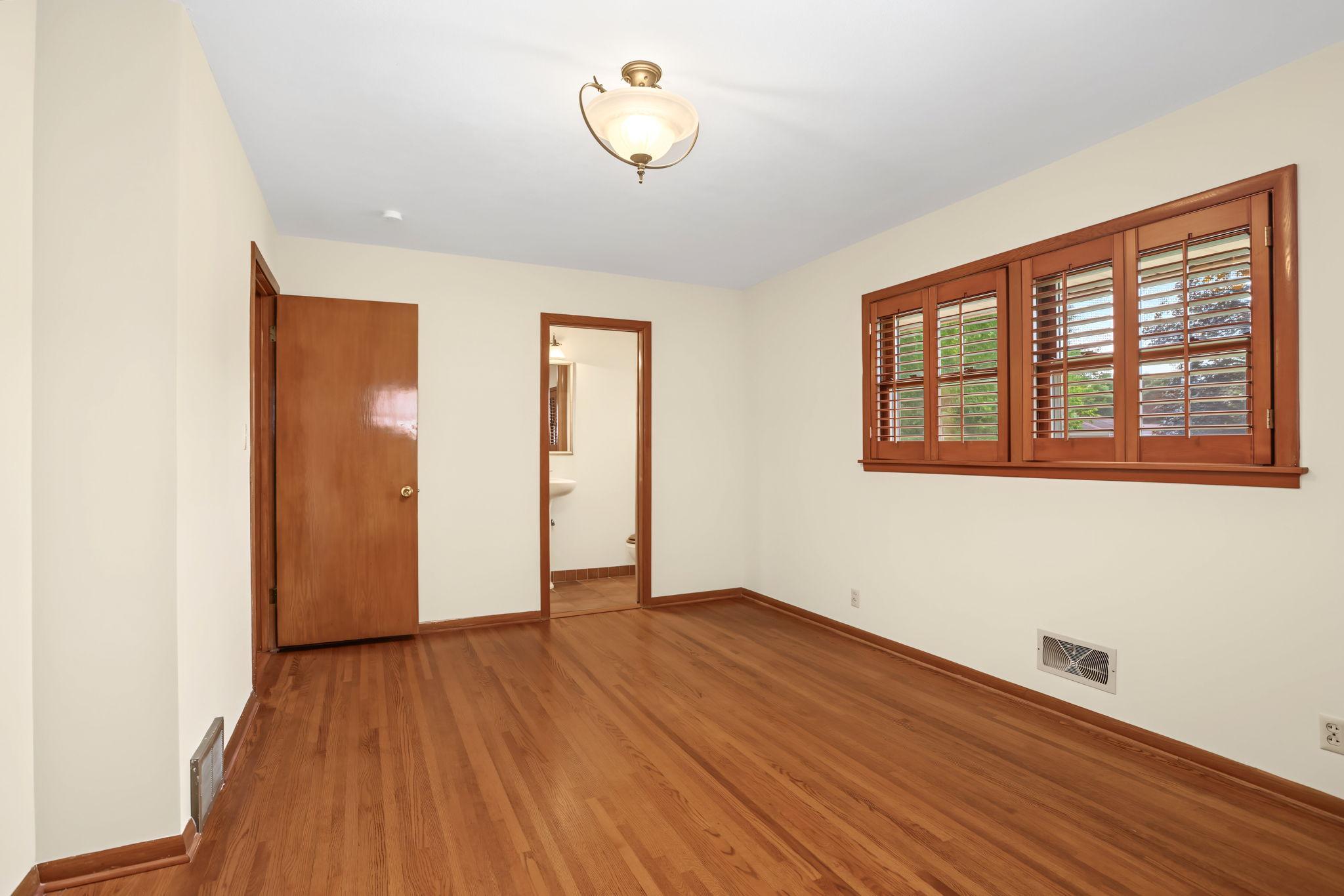 Large primary bedroom has an en-suite bathroom with shower.