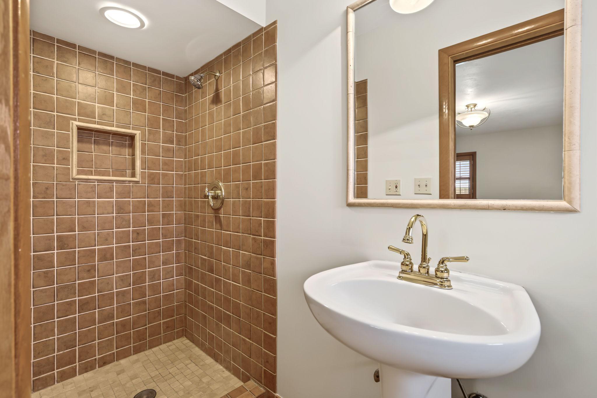 Updated tile shower in en-suite bathroom.