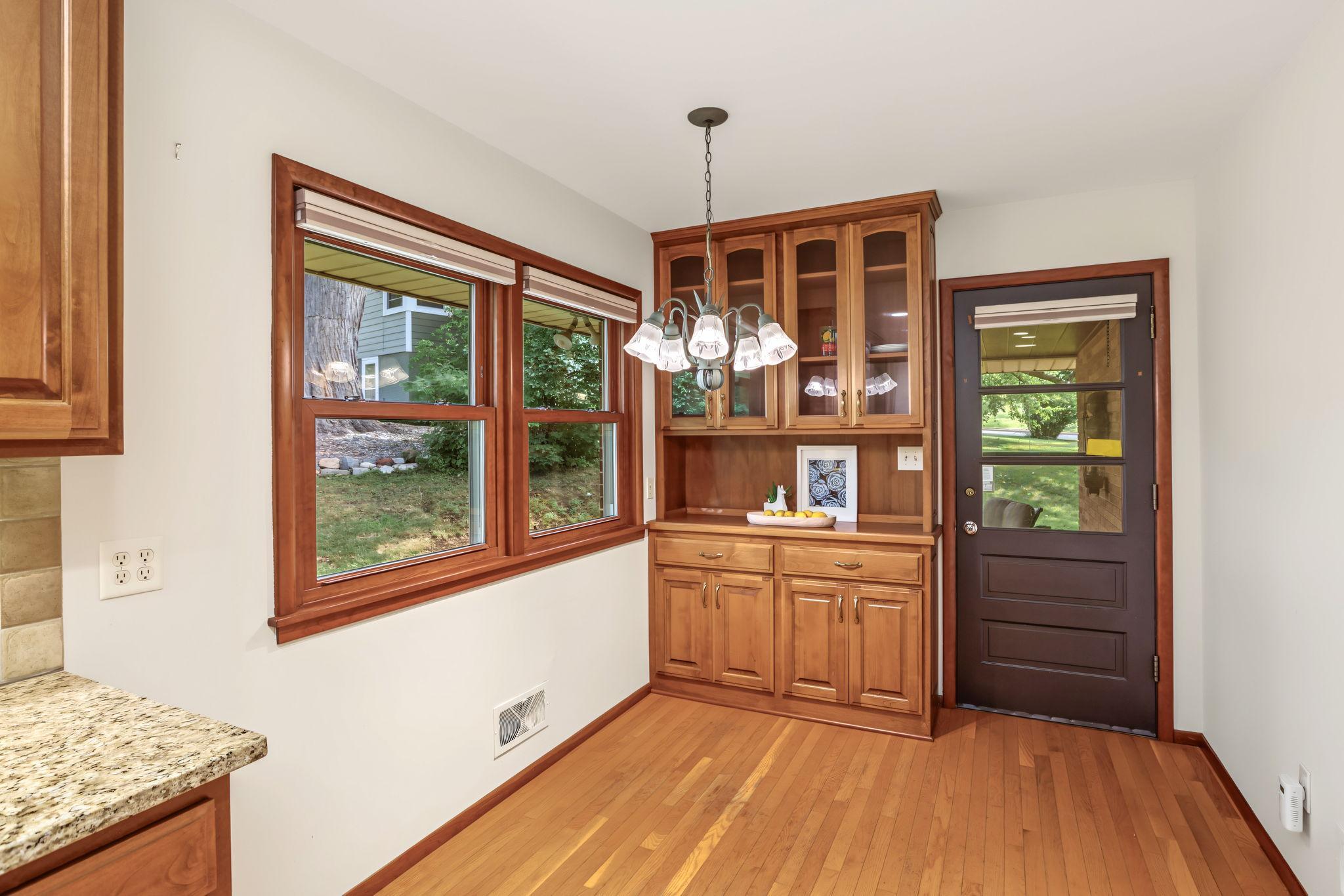 Door from kitchen leads to a covered patio, perfect for grilling.