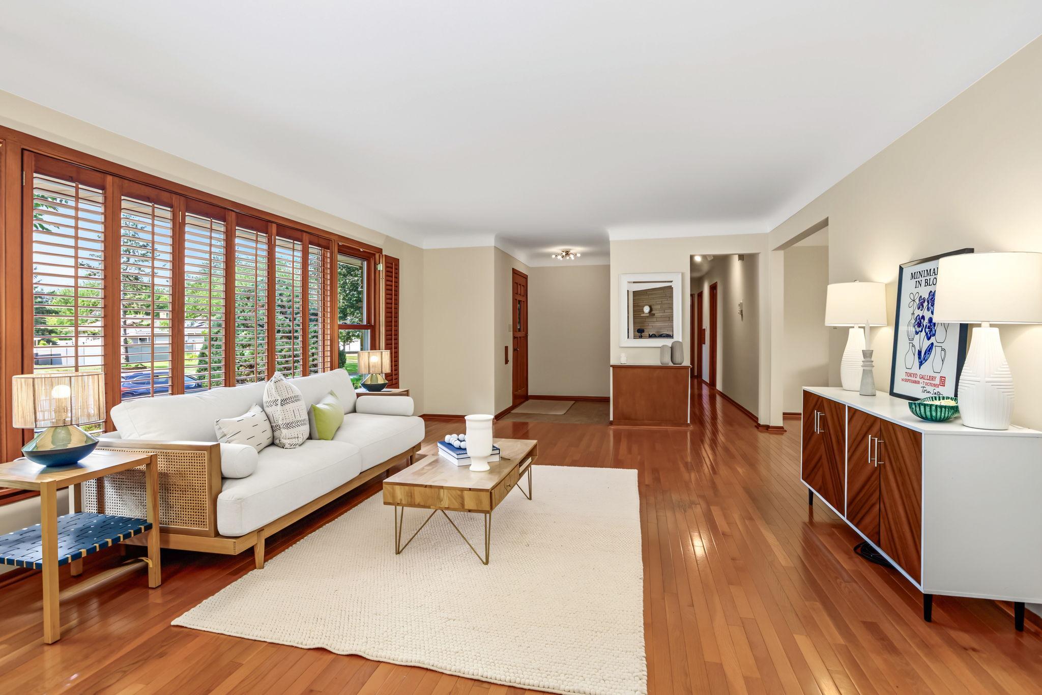 Main level is freshly painted with coved ceilings and hardwood floors throughout.