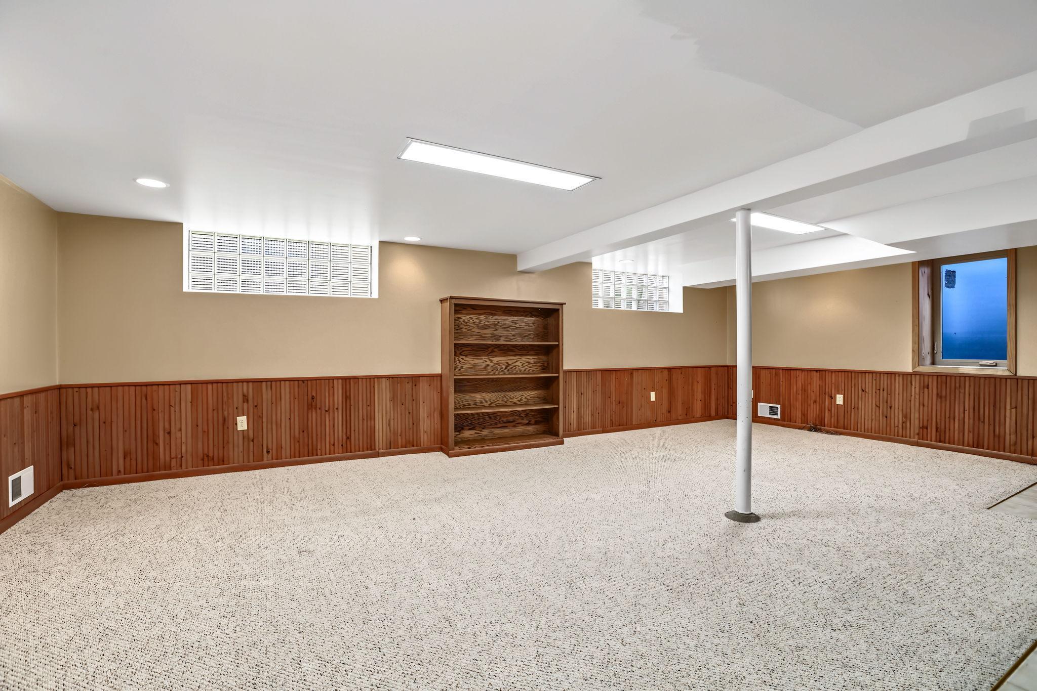 Fourth bedroom is filled with light from egress & glass block windows.