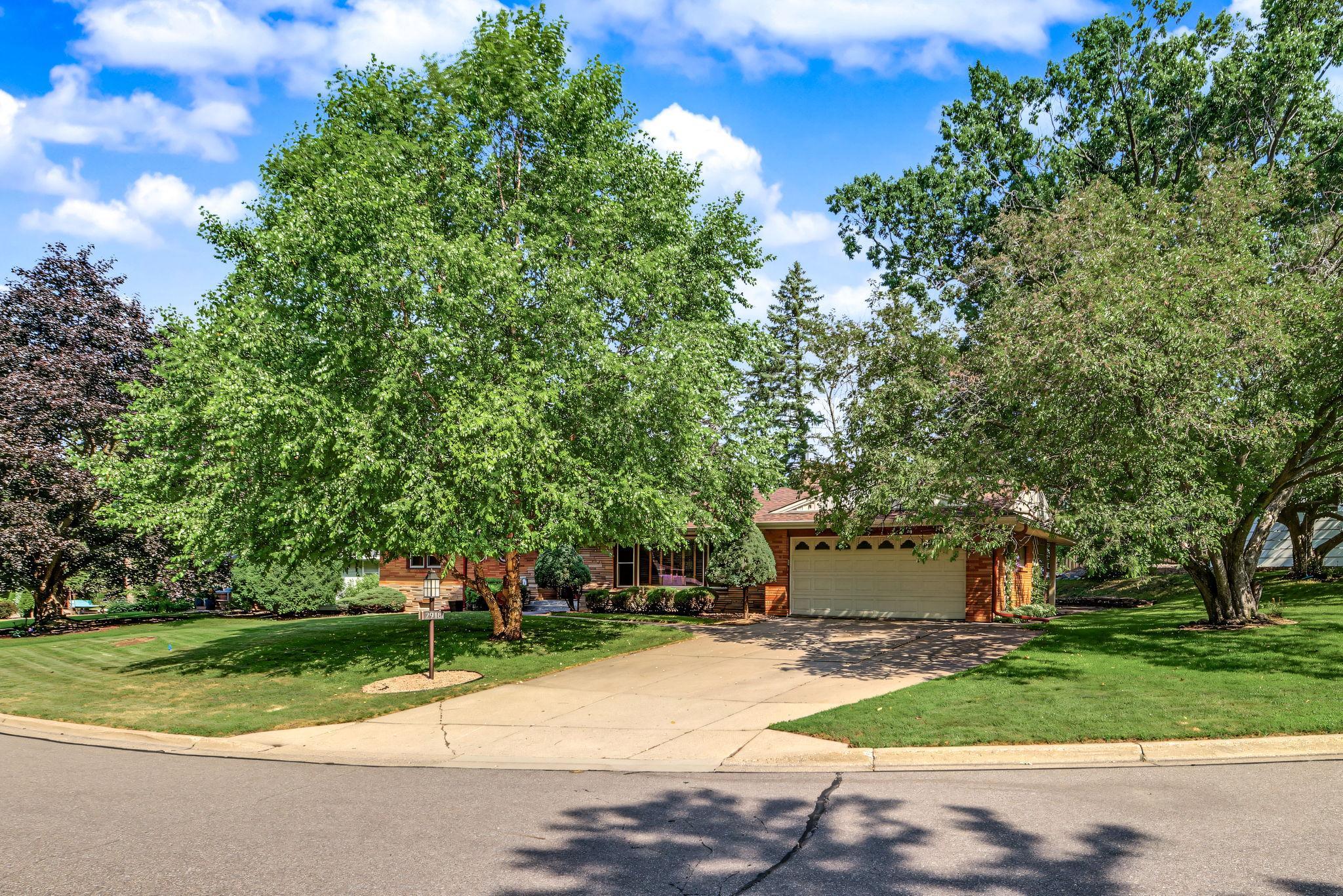 Another view of the front yard with beautiful trees.