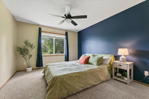 Main Level Bedroom with private backyard views and a walk-in closet!