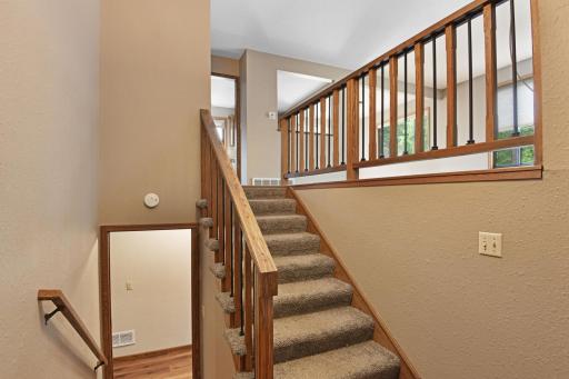 Iron accents add a modern flair to the ope stair case