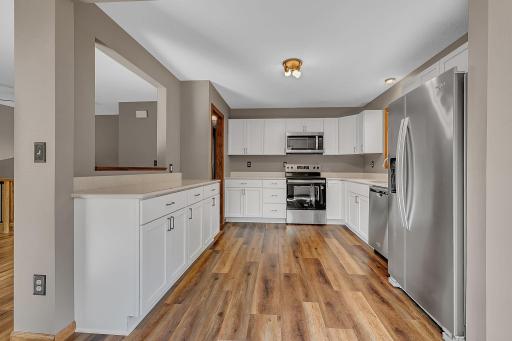 Well-equipped kitchen open to the dining and a snack bar open to the living room