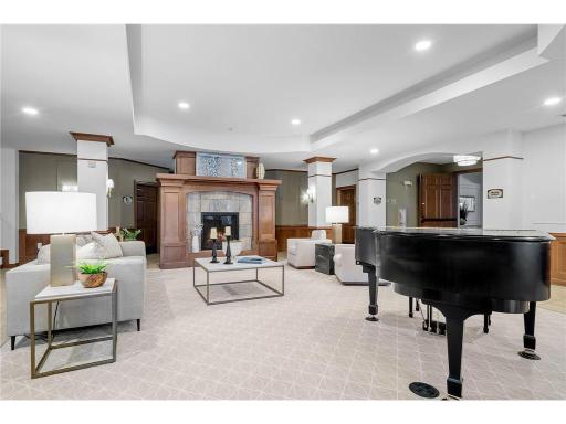 Gathering Area with Piano and community fireplace.
