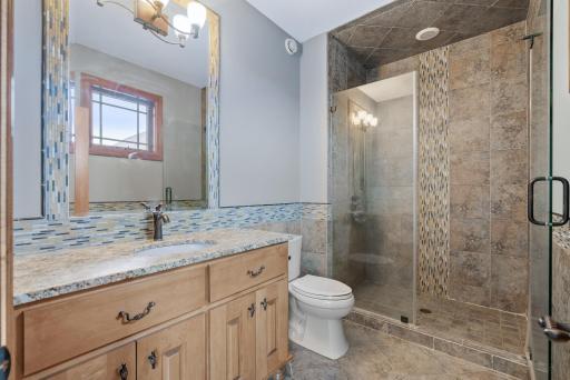 Both of the upper bedrooms have fully a tiled en-suite