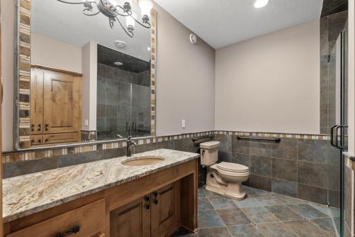 Lower level Bathroom with custom tile and granite