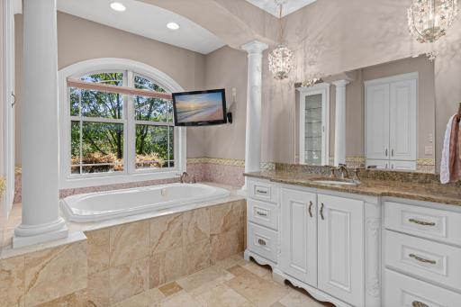 Fully tiled bathroom with fresh neutral paint and new granite vanity top