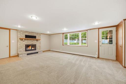 Family room with great lighting and fireplace.