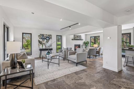 Walls of windows bathe the home in natural light.