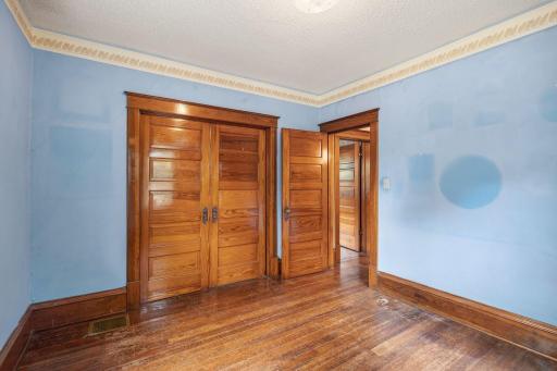 This gorgeous pocket door can adjoin these upper level bedrooms.
