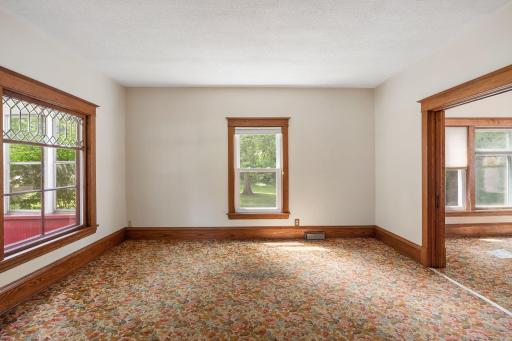 Remove this carpet and you will find the original hardwood floors