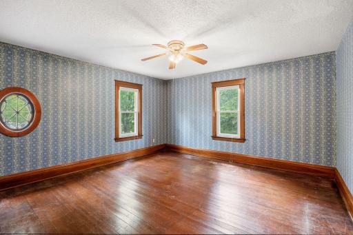 Gleaming original hardwood in there upper level bedrooms.