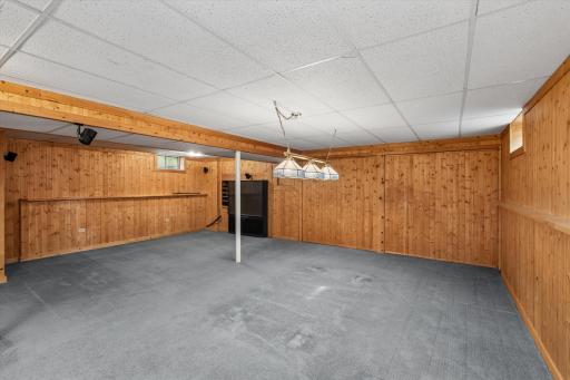 Family room has lots of built in cabinets for storage