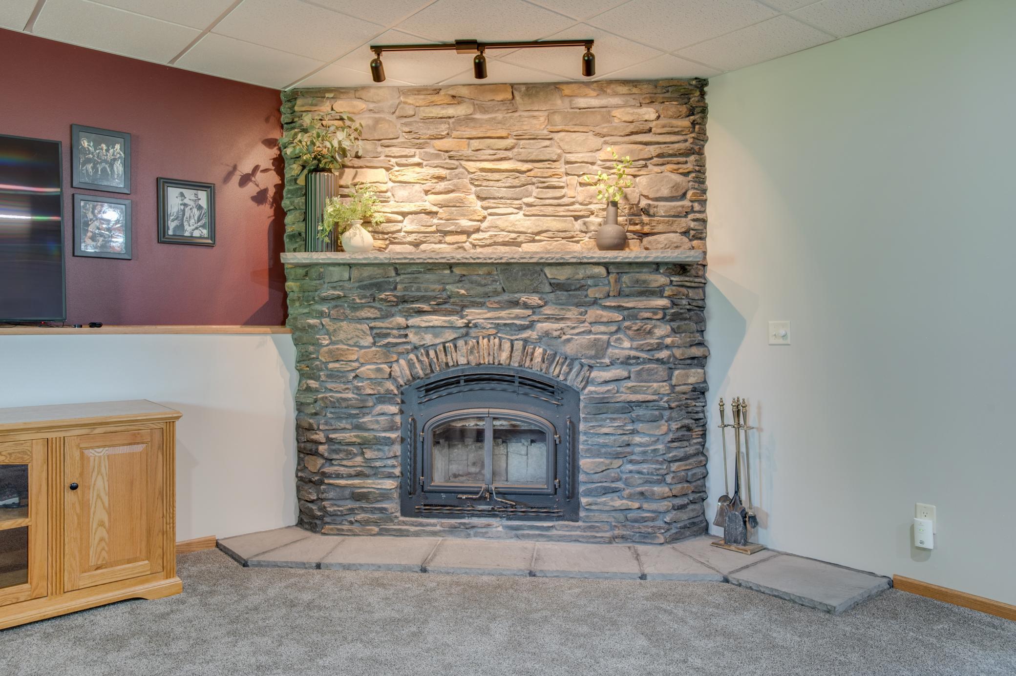 WOOD burning stone fireplace