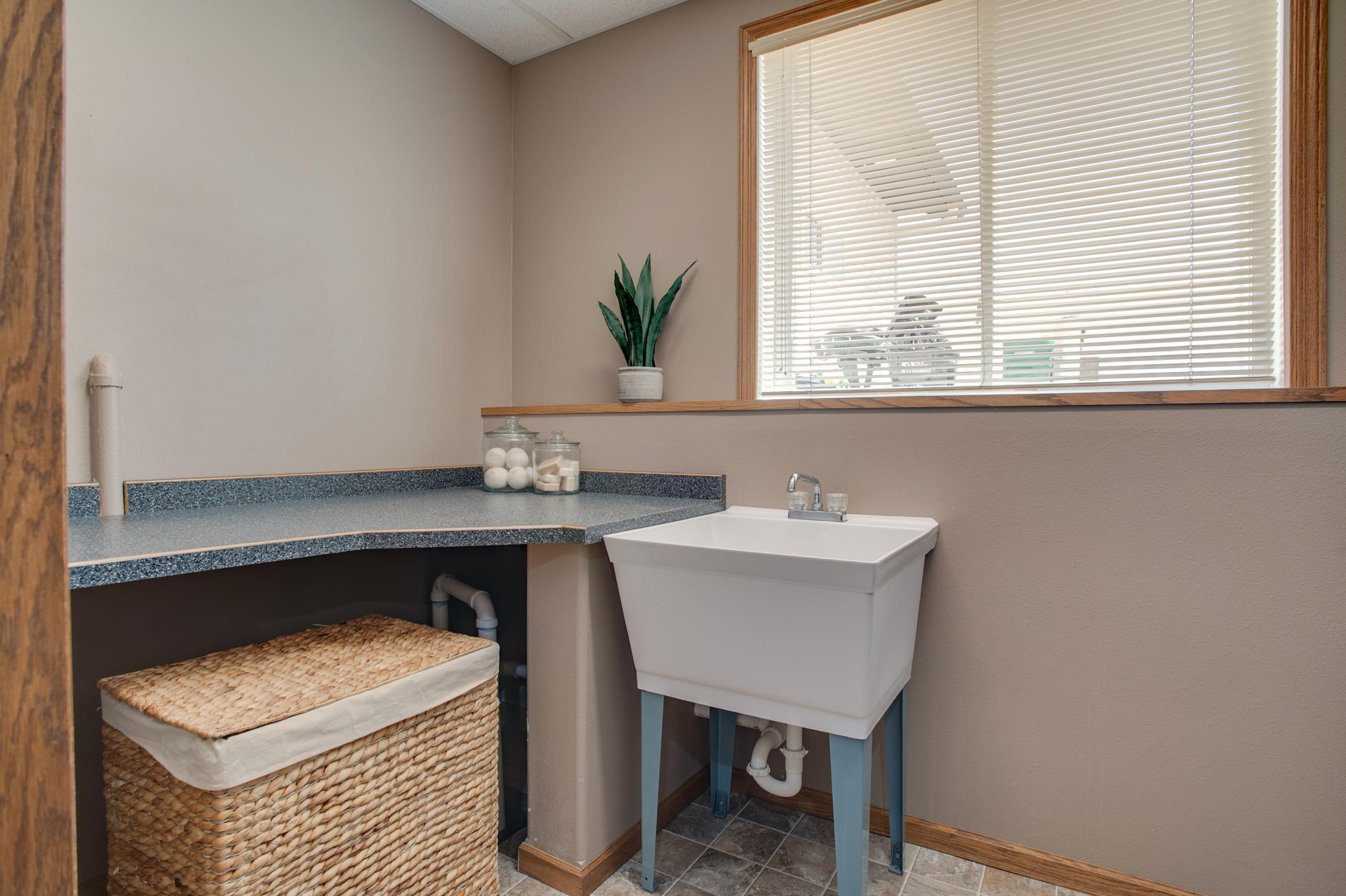 Laundry with utility sink and folding counter
