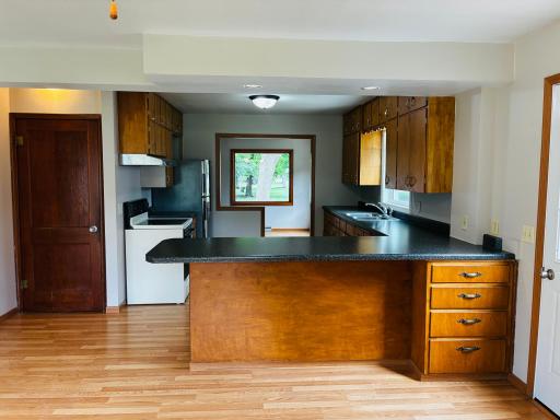 view from the back room through the kitchen to the living room in the front