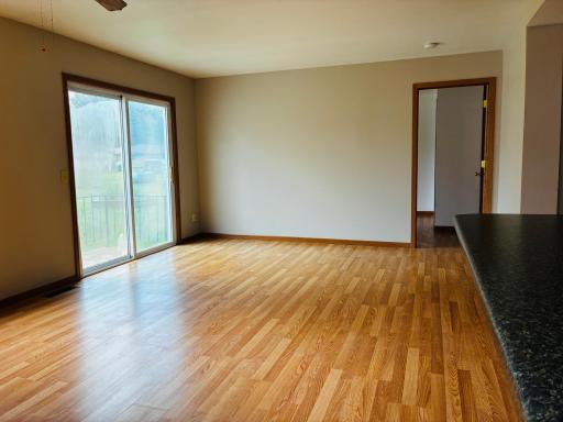 view from the back door into the back room with patio doors