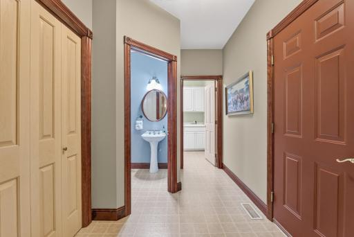 A stylish and functional powder room that perfectly serves the main living spaces.