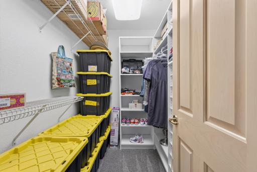 A spacious pantry provides exceptional storage and organization for the heart of the home.