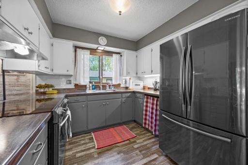Kitchen has stainless stell appliances, updated cabinets, counters & LVP flooring