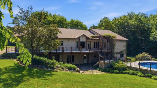 Expansive deck and lower patio for extended living space and outdoor entertaining. Custom pergola for ambiance and protection from the sun. Set up a variety of seating options for dining and living room style outdoor furniture.