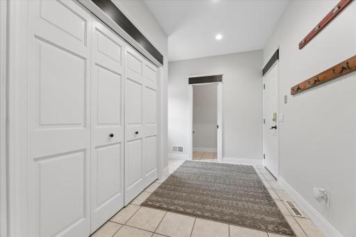 Entry from Garage with convenient 1/2 bath and walkout to back deck