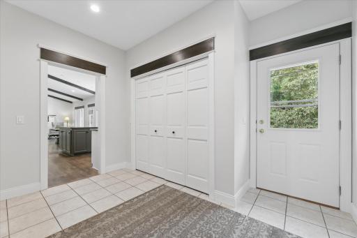 Entry from Garage with convenient 1/2 bath and walkout to back deck