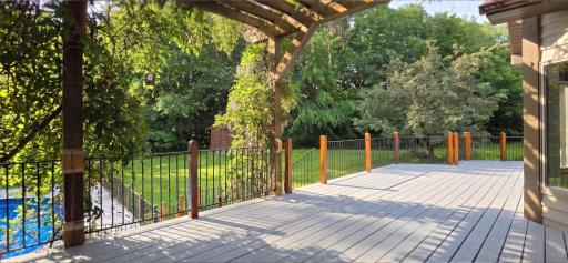 Romantic Custom Pergola Covered in Wisteria, overlooking pool and private backyard.