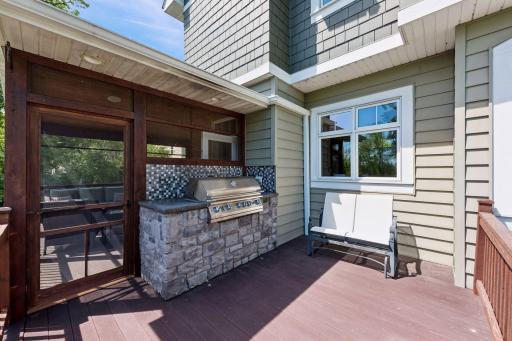 Outdoor entertaining at its finest! The expansive deck is crafted from maintenance-free Trex decking and features a premium built-in grilling station. Equipped with a new Lion Premium rotisserie grill, you will become the ultimate grill master.