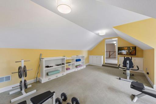 Currently, this bonus room is a home gym, but the doorway is framed to easily accept a standard door if you want to create a 4th upper bedroom.